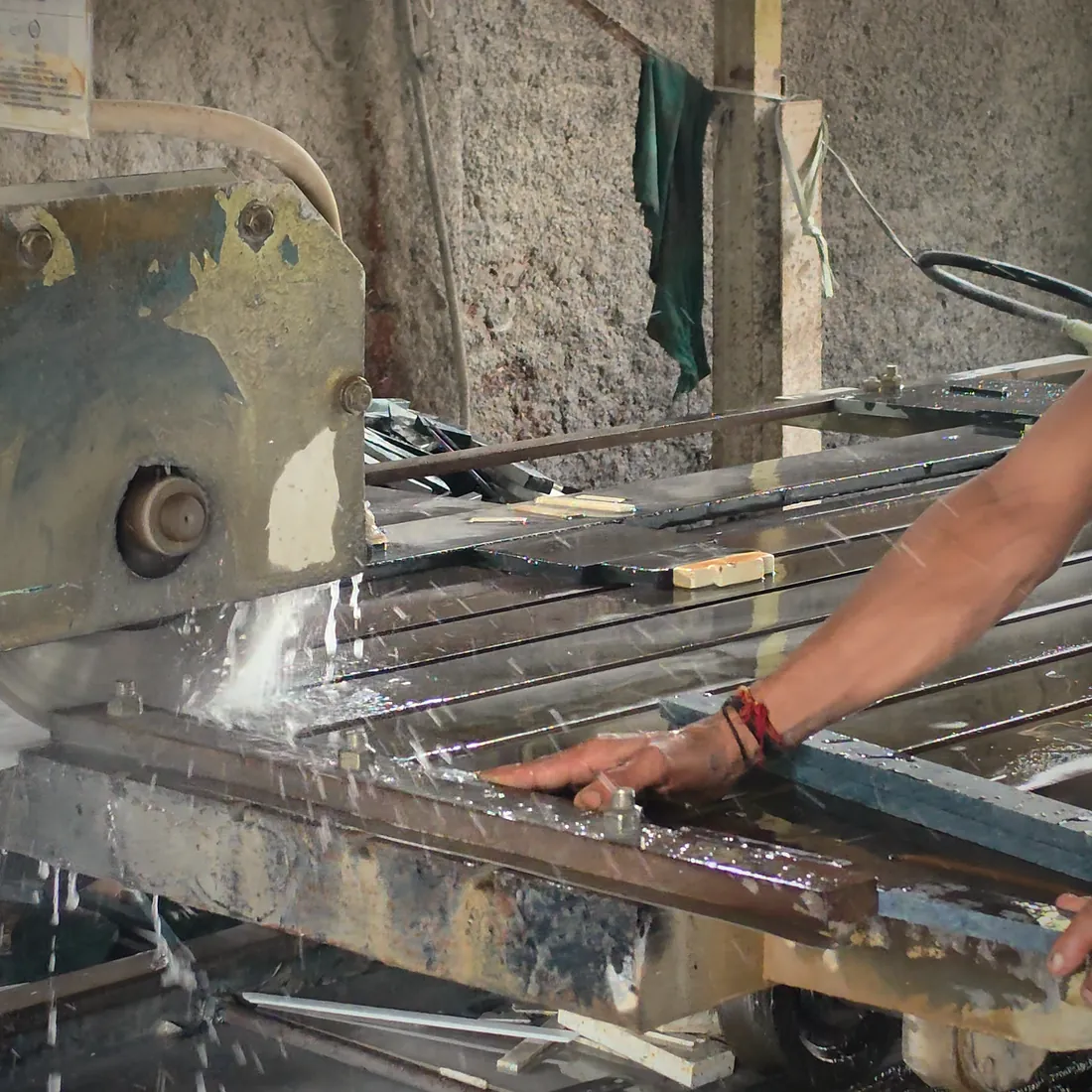 Cutting a slab to size on the bridge saw.